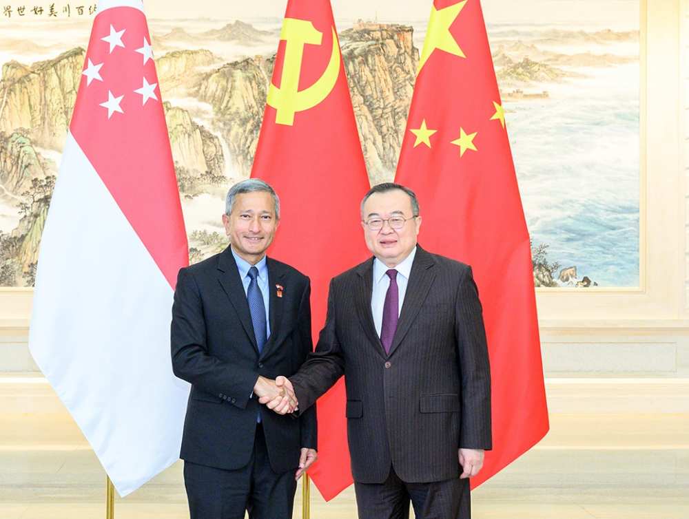 中共中央对外联络部部长刘建超会见新加坡人民行动党中央外事委员会主席、新加坡外长维文